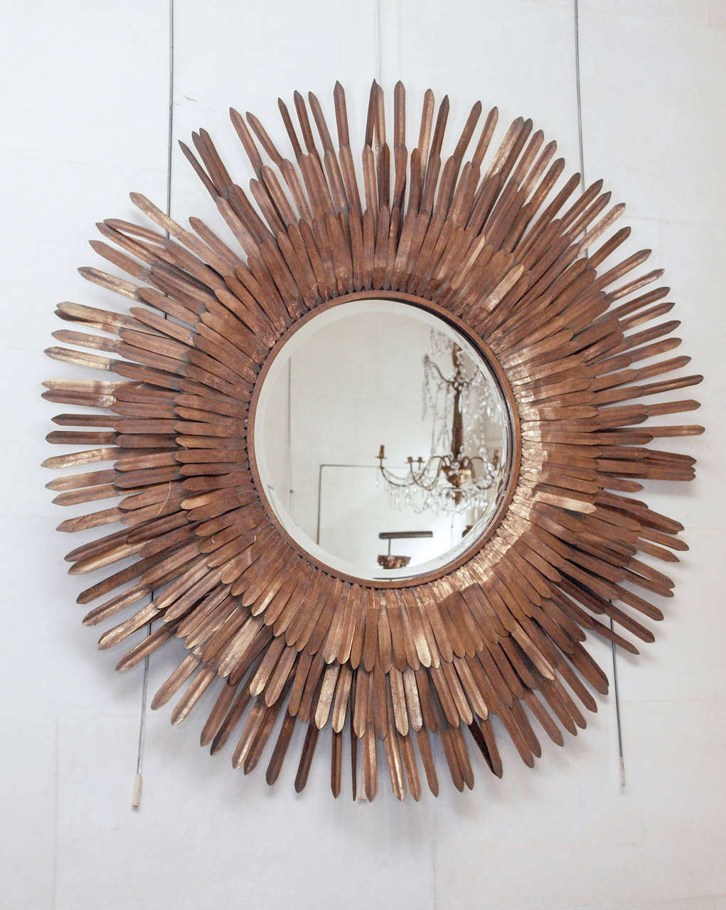 20th century Italian gilt metal sunburst beveled mirror.