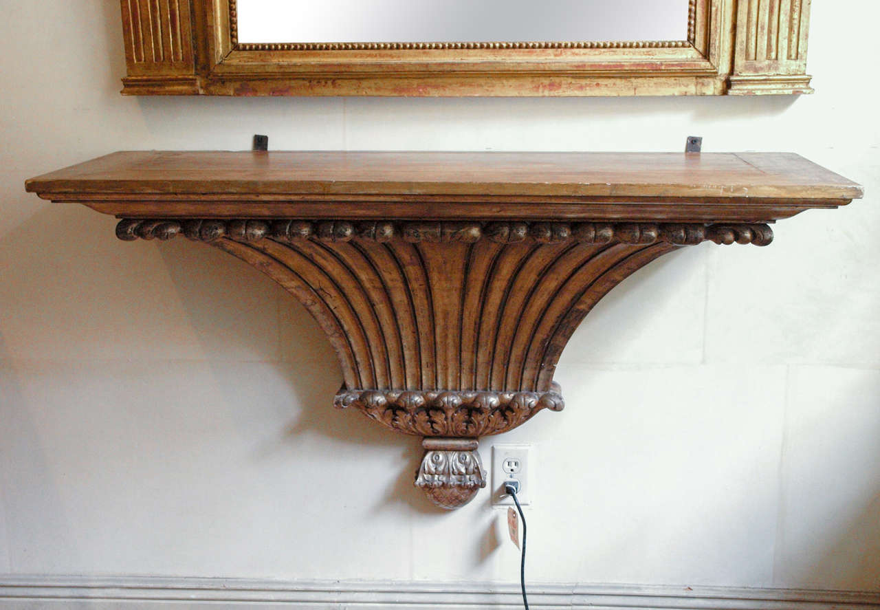 A 19th c. French giltwood wall console. It would grace a small foyer, placed beneath a mirror.