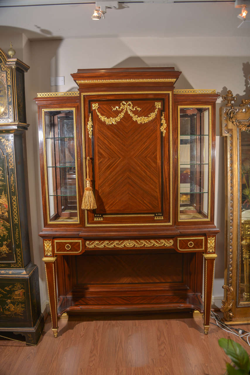 19th c signed P Sormani French Louis XVI viewing cabinet. The cabinet is illuminated and made from Mahogany with ebony inlay. Beautiful first quality bronze dore mounts. 
Signed in the Lock plaes P. Sormani with the address