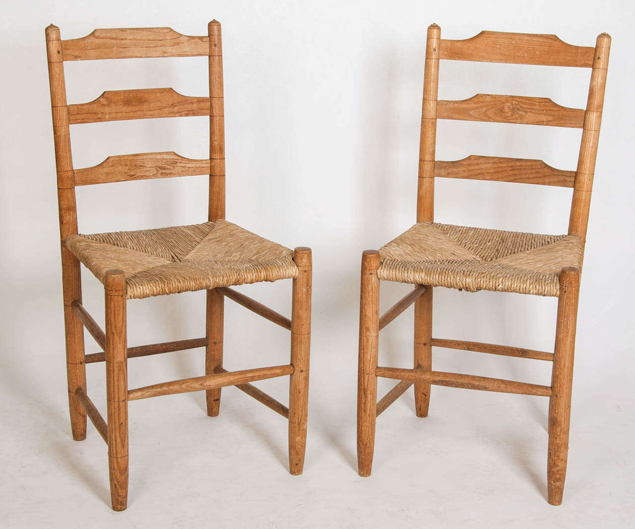 Pair of "Russell" Rush-Seated Turned Chairs, English, Circa 1929