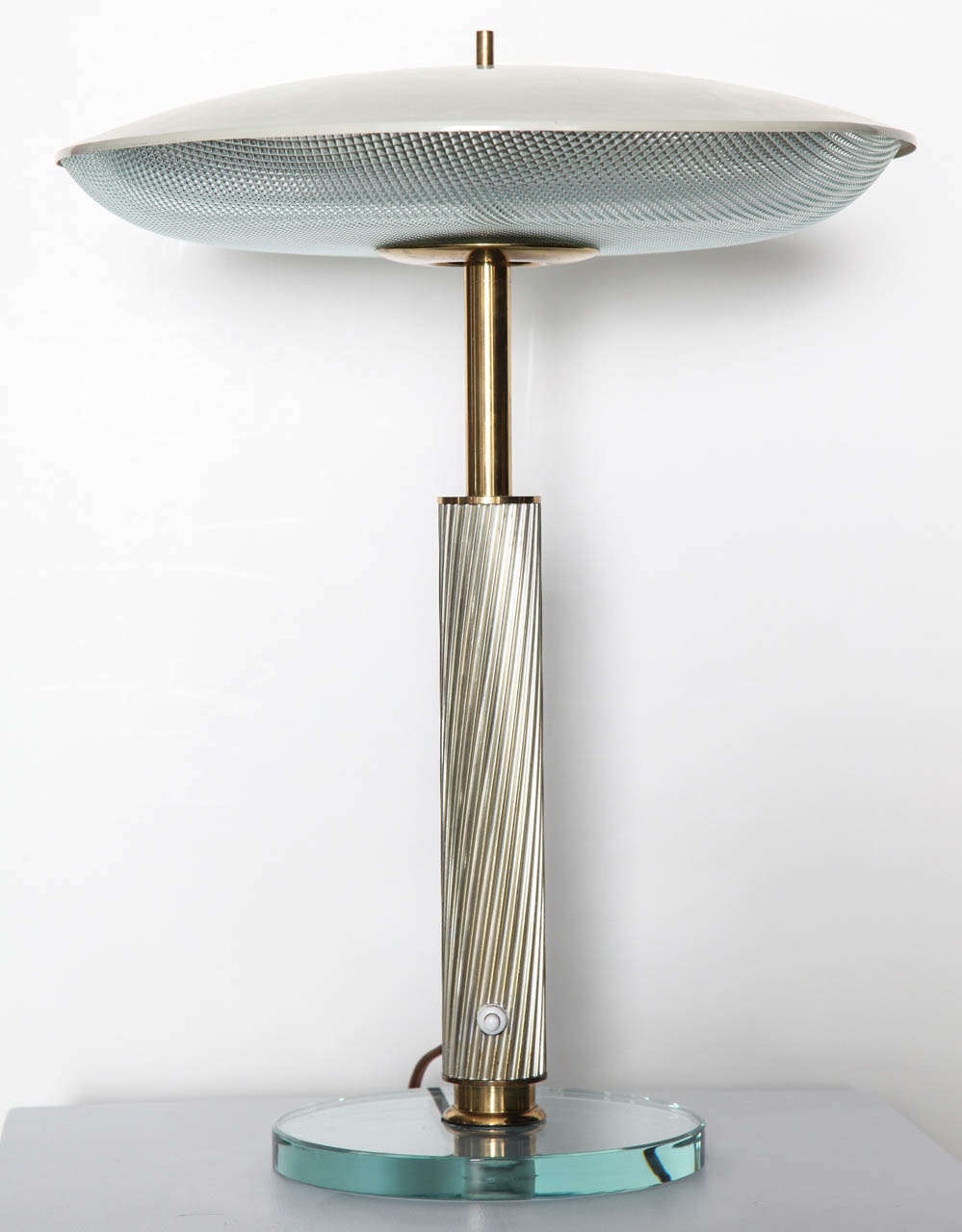 Textured and smooth glass elements.  Enameled aluminum, textured metal, and polished brass.  Pivoting shade with 3 candelabra sockets.  A very rare form in great condition.
