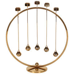 Sculptural Brass Pendulum Candelabra