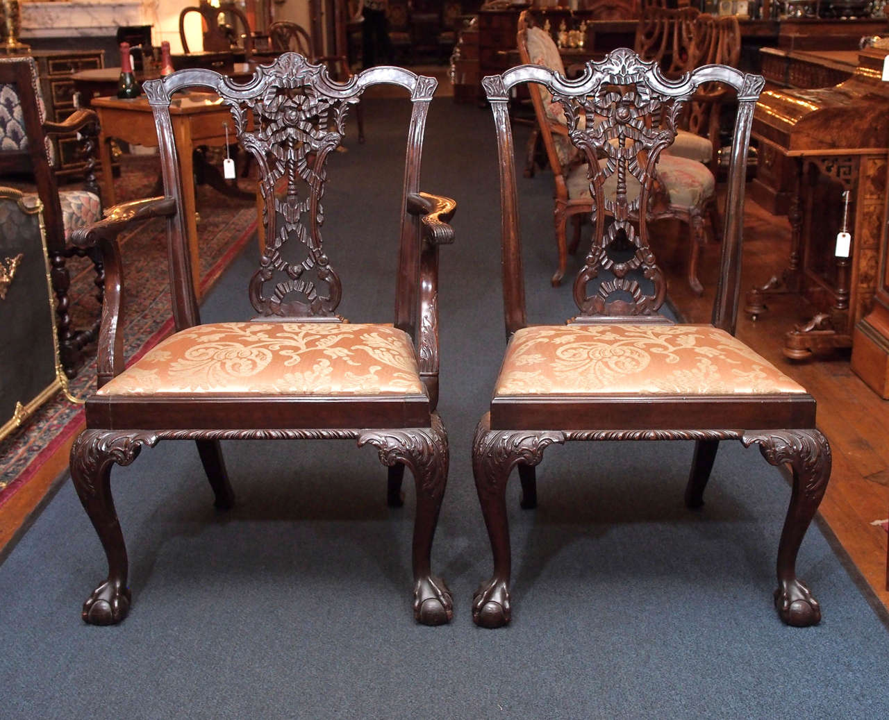 These are fine examples of English furniture design, with the interlaced ribboning and graceful cabriole legs.