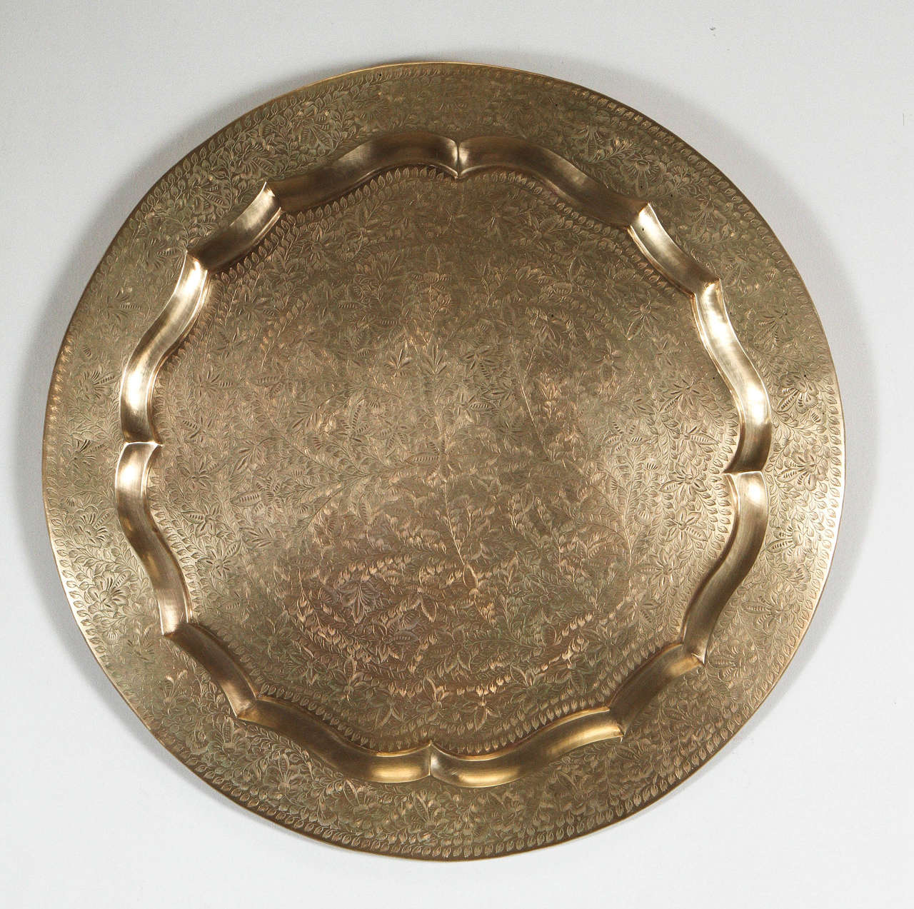 Anglo-Indian round brass tray wall hanging, amazing artwork, very finely hand-hammered.
Has a hook in the back for hanging.
You can also use it as a serving platter or on an ottoman, or as a brass tray table.
Made in India Anglo Raj hand-engraved