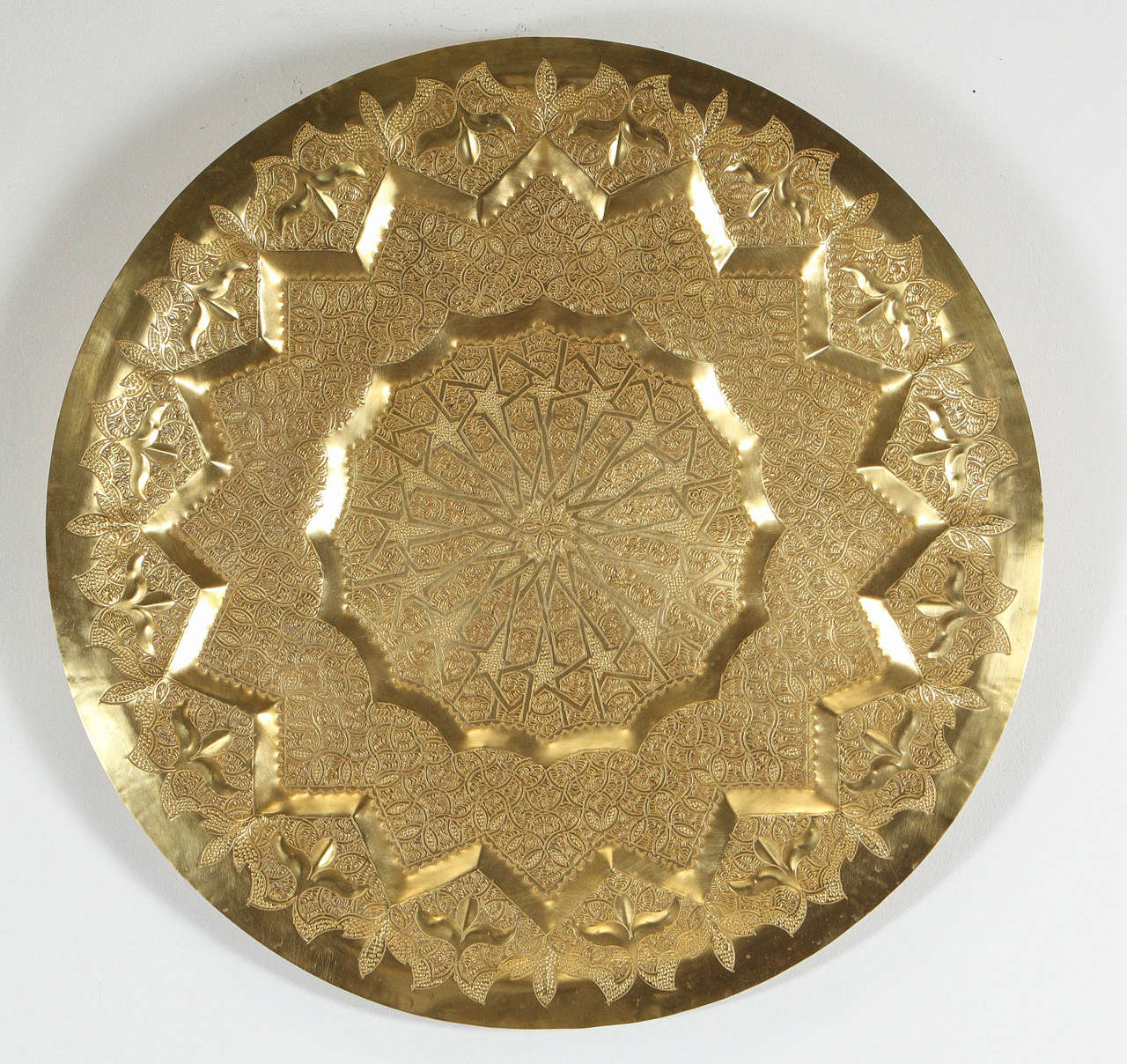 Fabulous Moroccan Moorish hand-hammered brass tray, intricate multi dimension artwork, very fine Anglo Raj brass repousse designs.
Handcrafted wall hanging decorative brass tray with a copper hook in the back.
Fabulous hand-etched wall hanging brass