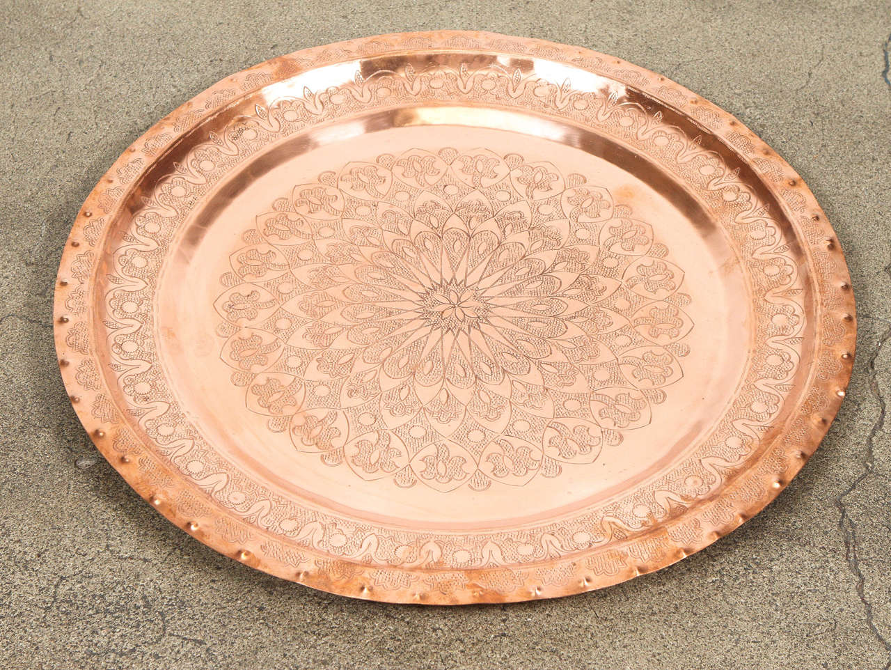 Large antique hand-hammered Moroccan copper tray platter.
Great Islamic art brass metal work, hand-chiseled with intricate fine Moorish floral and geometrical Moorish designs.
Polished and cleaned ready to use indoor or outdoor .
