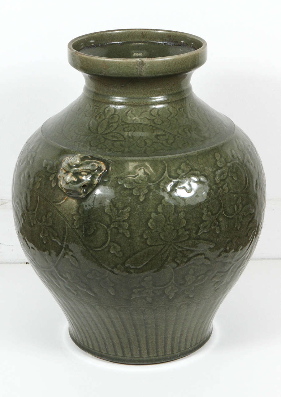Large-scale polished Celadon green ceramic vase, early 20th century.
Decorated with flowers pattern and covered with natural cracking pattern.
Has been repaired, please check picture # 8.