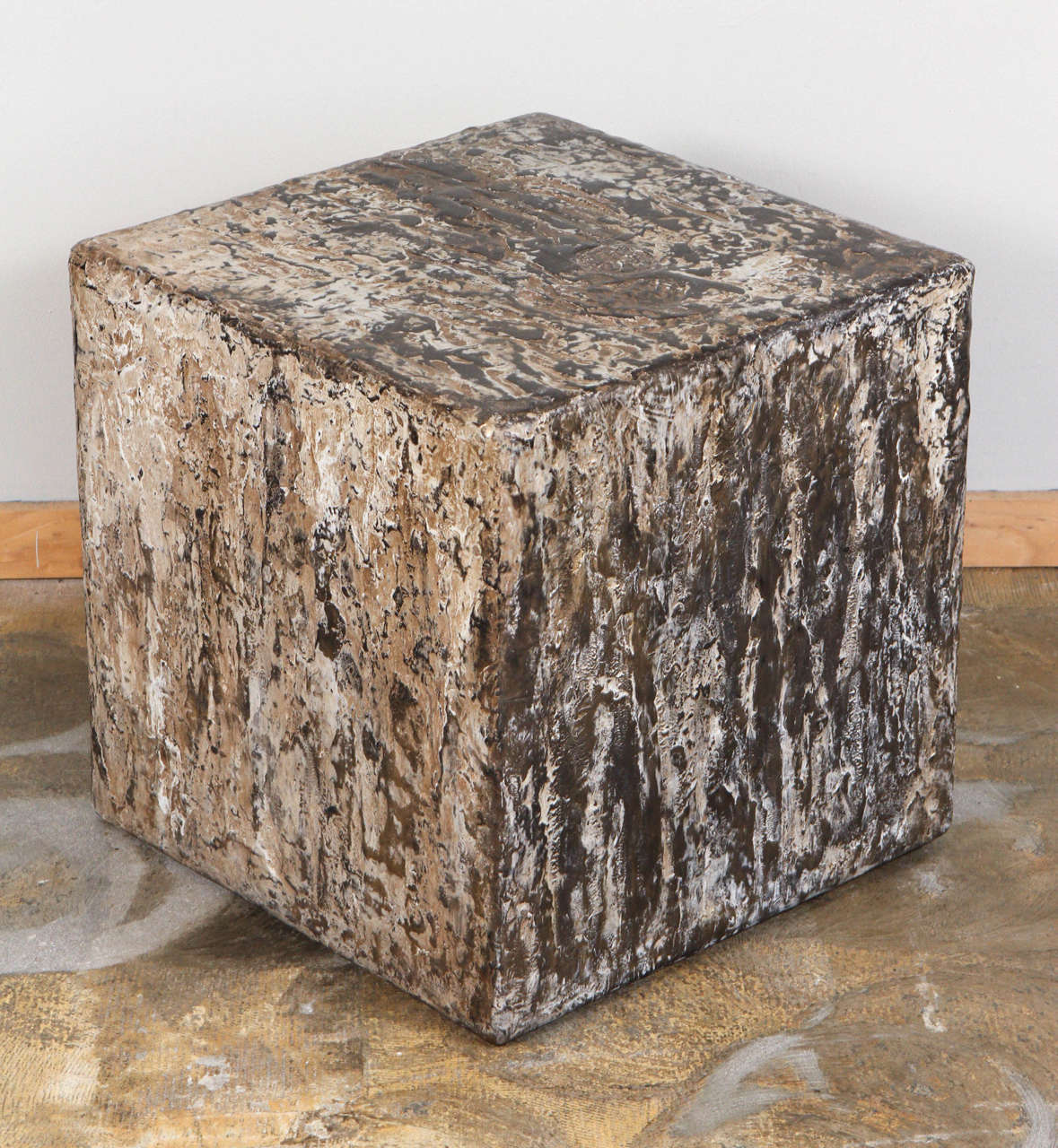 Resin, gold and mica combine resulting in unique textures on each side of this solid square table. Handmade and therefore all six sides are different and cannot be replicated exactly. A functional, sculptural art piece.