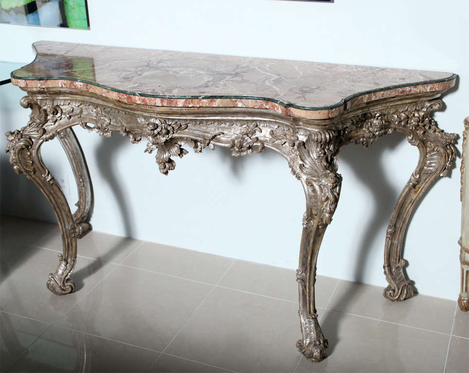 The jasper top with banded marble edge above a frieze elaborately and robustly carved with bellflowers, foliate, leaf and shell motif above exaggerated cabriole legs similarly carved to the frieze - an exceptional example.