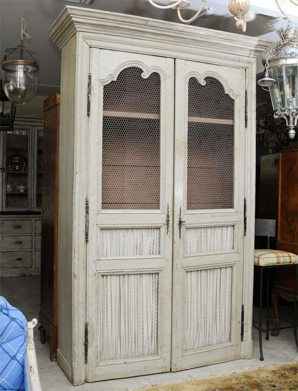 This is a very nice hand painted food cupboard with chicken wire.
Its off white color,with the original key.
It could be also a great armoire or great cabinet.It has plenty of space inside.