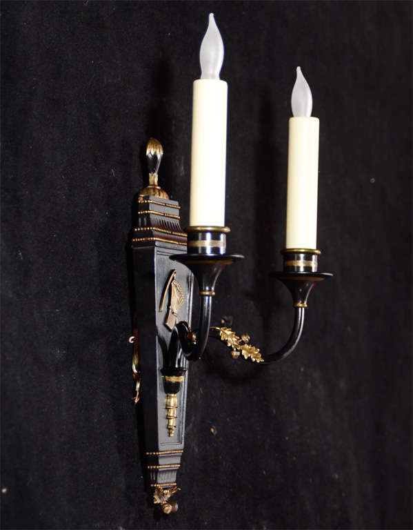 Polychromed wood, bronze and brass sconces by 