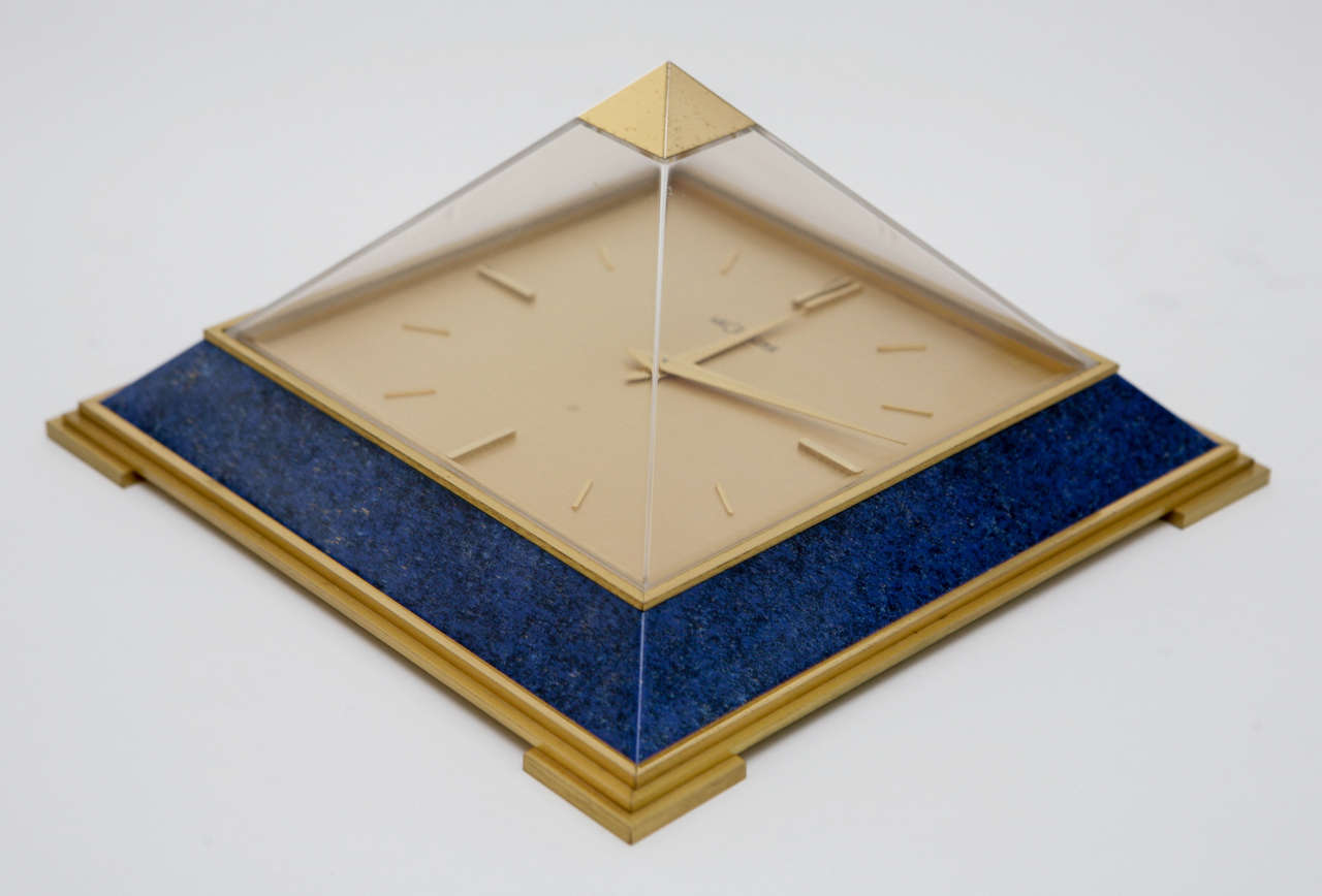 A striking pyramid shaped clock with an 8 day Swiss movement, a Dore bronze case and faux lapis lazuli by Le Coultre. Comes with original box and 