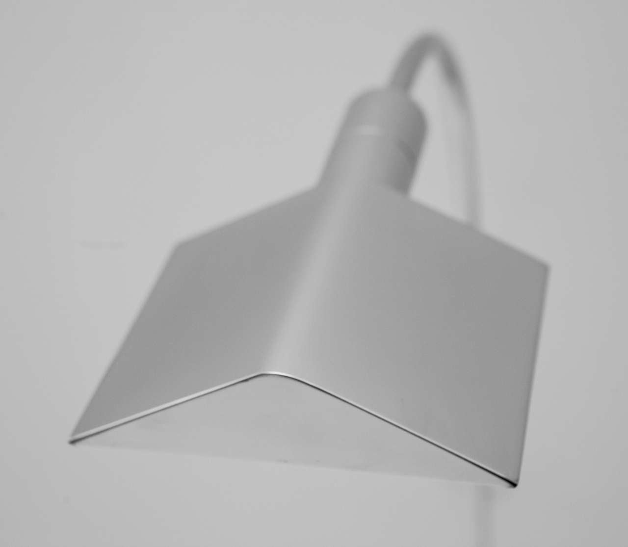 A beautiful Hartman Task Lamp in a nickel finish.  The lamp is adjustable in both height and placement of the light source.  It is signed on the underside (see last image).