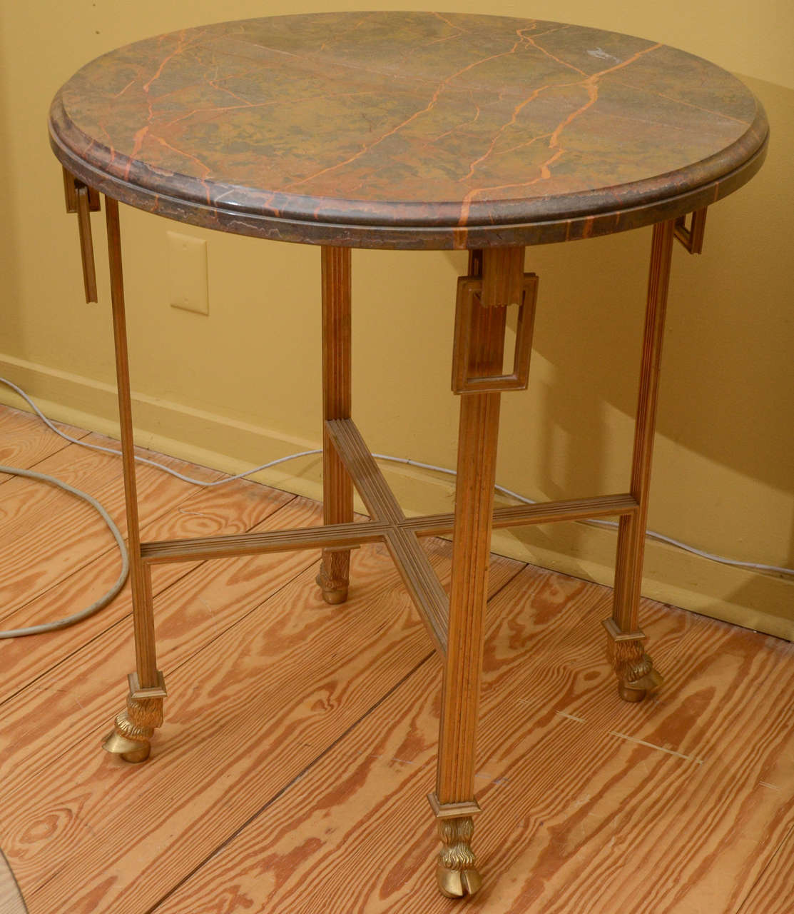 Marble-top table with bronze base in the French deco style. Made in France.