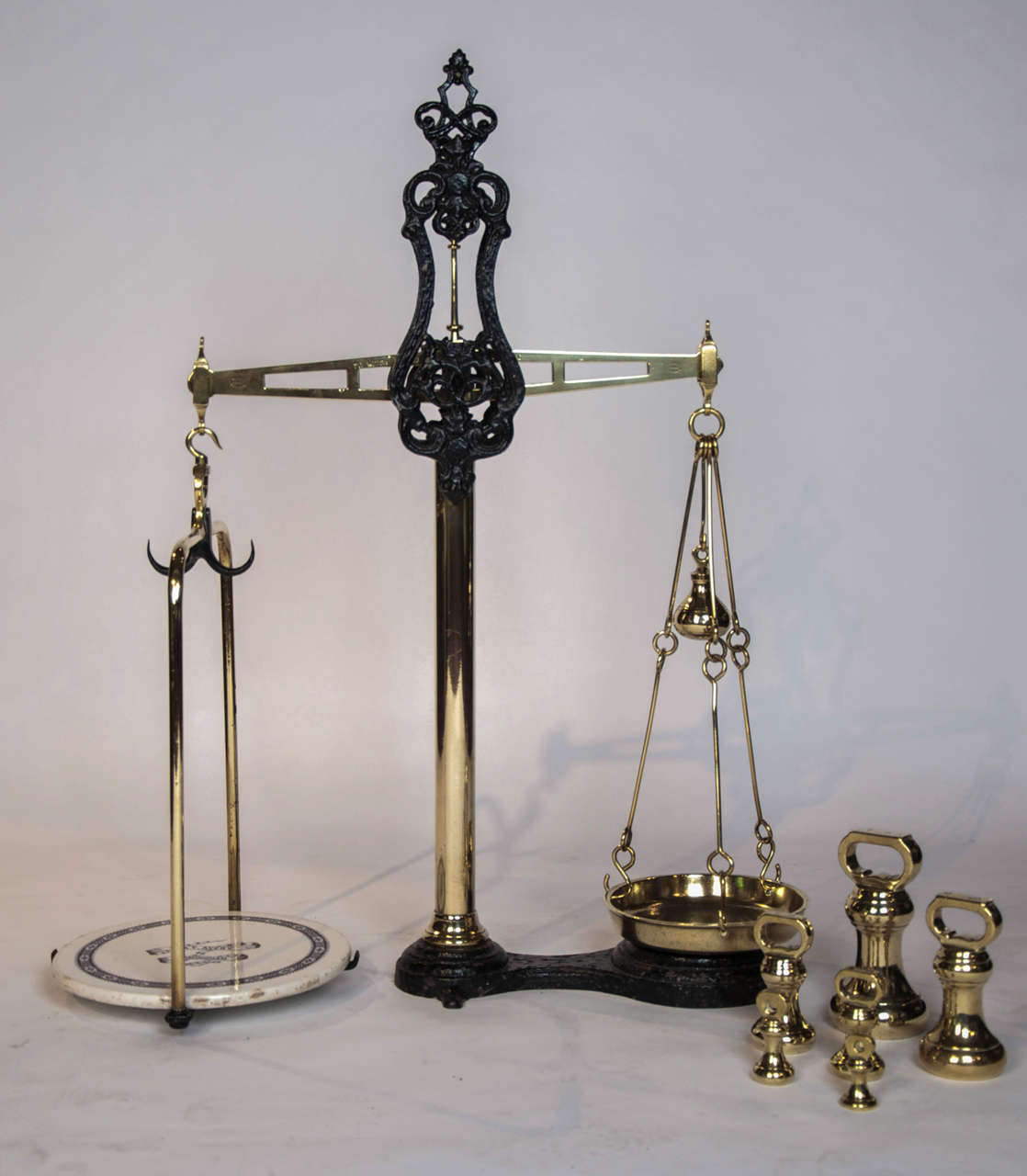 A fine and decorative set of Victorian brass and painted iron weighing scales by W&T Avery of Birmingham. Stamped Patent Agate Balance.
