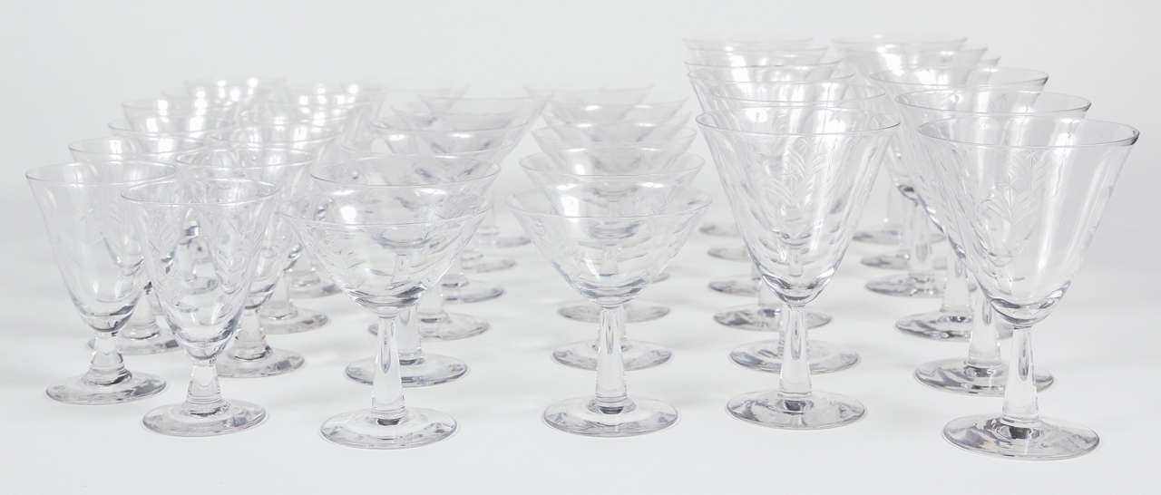 Set of 36 Mid-Century etched crystal glasses. 

Measures: 12 wine 5