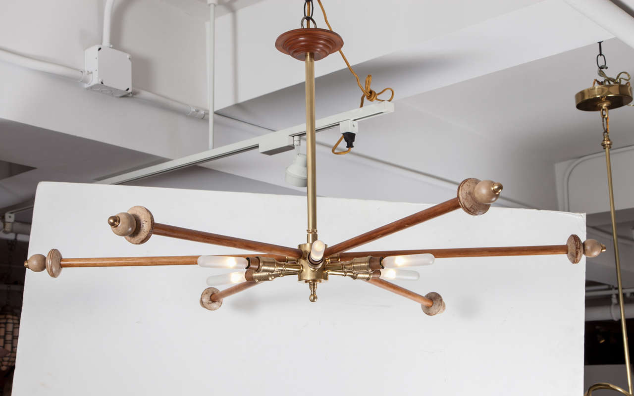 Wood and brass sputnik light fixture with six lights and six decorative arms.  USA, circa 1970.  Wired for U.S.; takes six chandelier base bulbs, 60 watts max each.