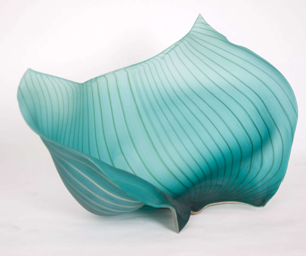The large sculpture in teal colour with white filigrana is one of the finest examples of large scale freeform blown studio glass. Unique piece. 

