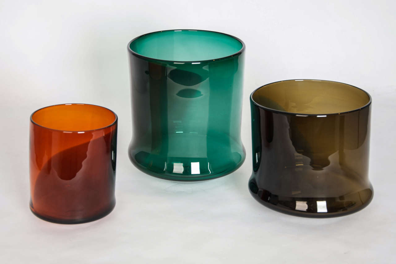 By British studio artist Stewart Hearn. Centrepiece composition of three soft pots in bold color combinations, which appear to be fashioned from the palette of a painter are integral to the studied simplistic form. Handblown in limited edition of