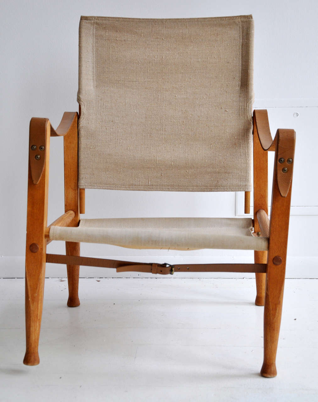 Found during travels to Paris, this pair of Danish Safari chairs are a true collector's item. All original from the 1960's, some minor signs of wear, relative to age and use. Sold as is.