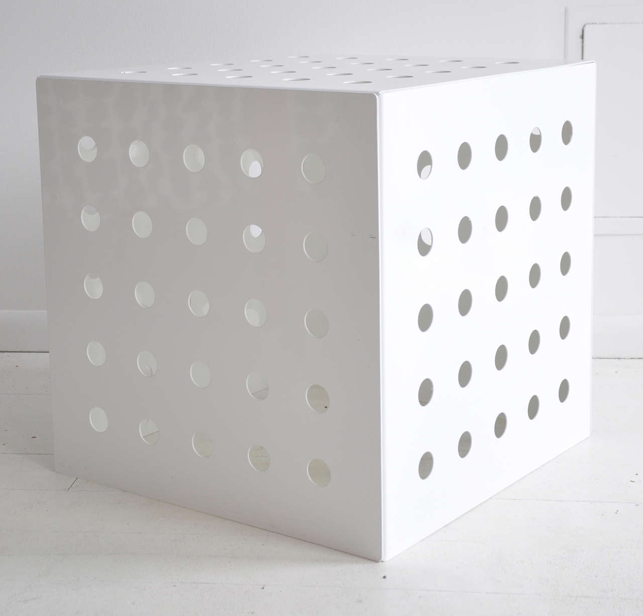 This geometric table is a great accent piece in a pristine white finish.