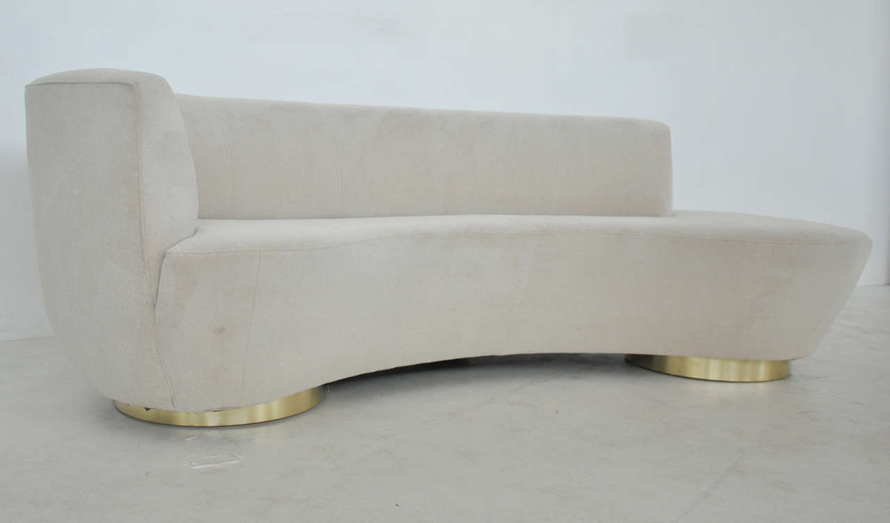 Serpentine sofa by Vladimir Kagan for Directional. Brass bases with original upholstery.