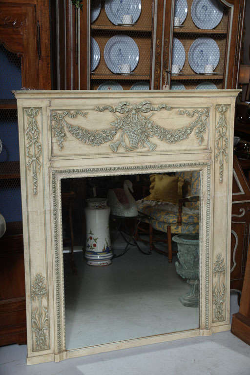 Elegant French Trumeau with beautiful detailing at top and sides.  Beautiful light French green paint with perfect patina.  Would enhance any fireplace mantel.