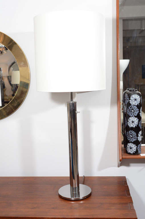 Pair of minimalist chrome table lamps by Nessen Studio, founded by Walter Von Nessen. USA, circa 1960. 

Newly rewired with French black silk twist wire. Features on/off switch on stem. Includes custom white paper drum lamp shades.

Dimensions:
7