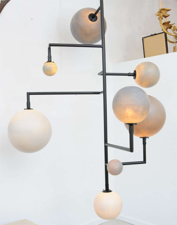 Super long Italian light fixture with resin balls and black iron armature.