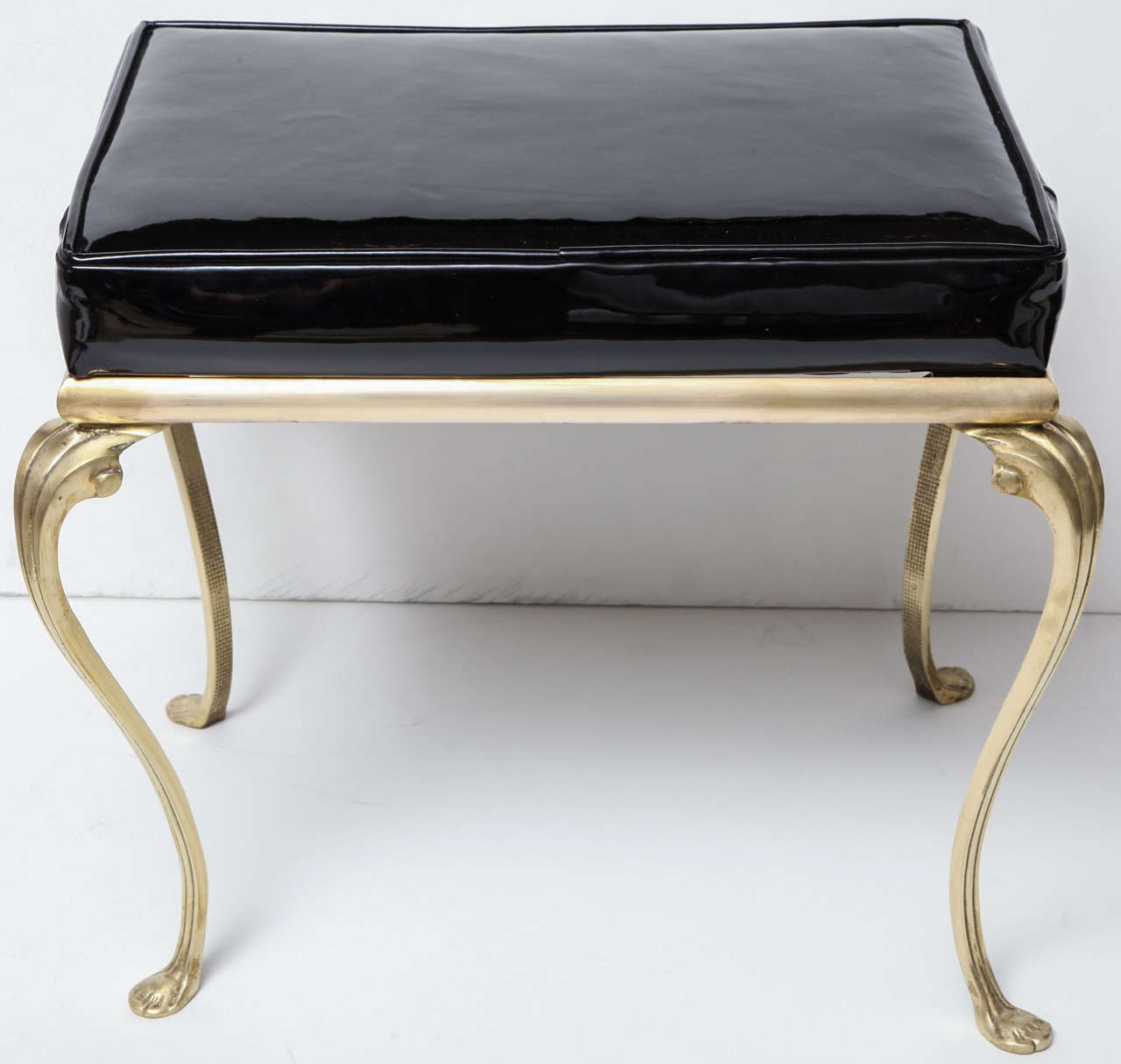 Decorative brass bench with pattern leather, C 1940.