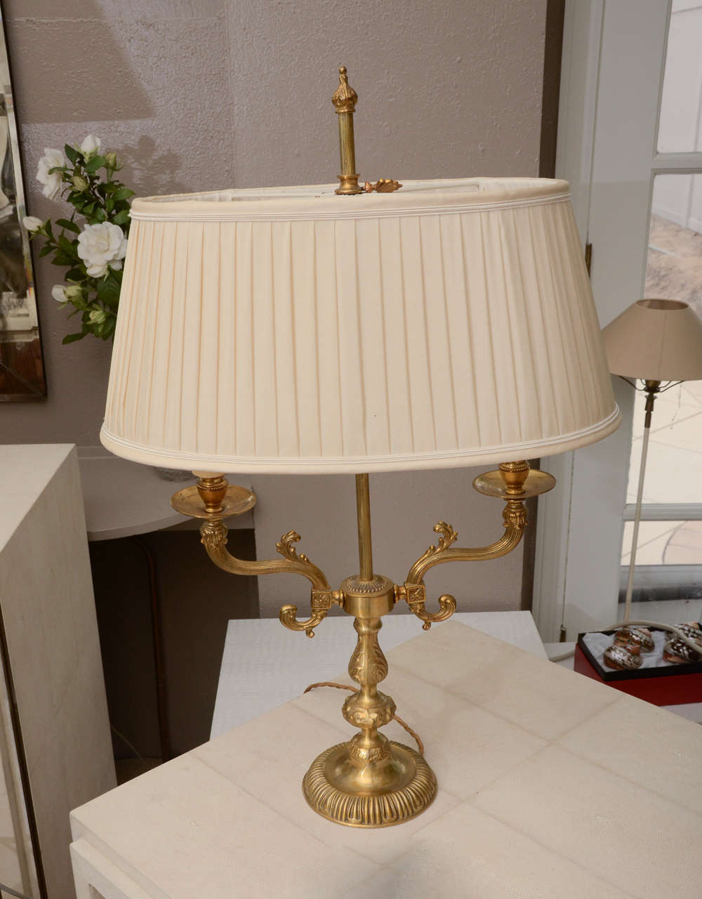 2-armed Dore bronze candlestick lamp with silk pleated shade. The height to the top of the finial is 27 in