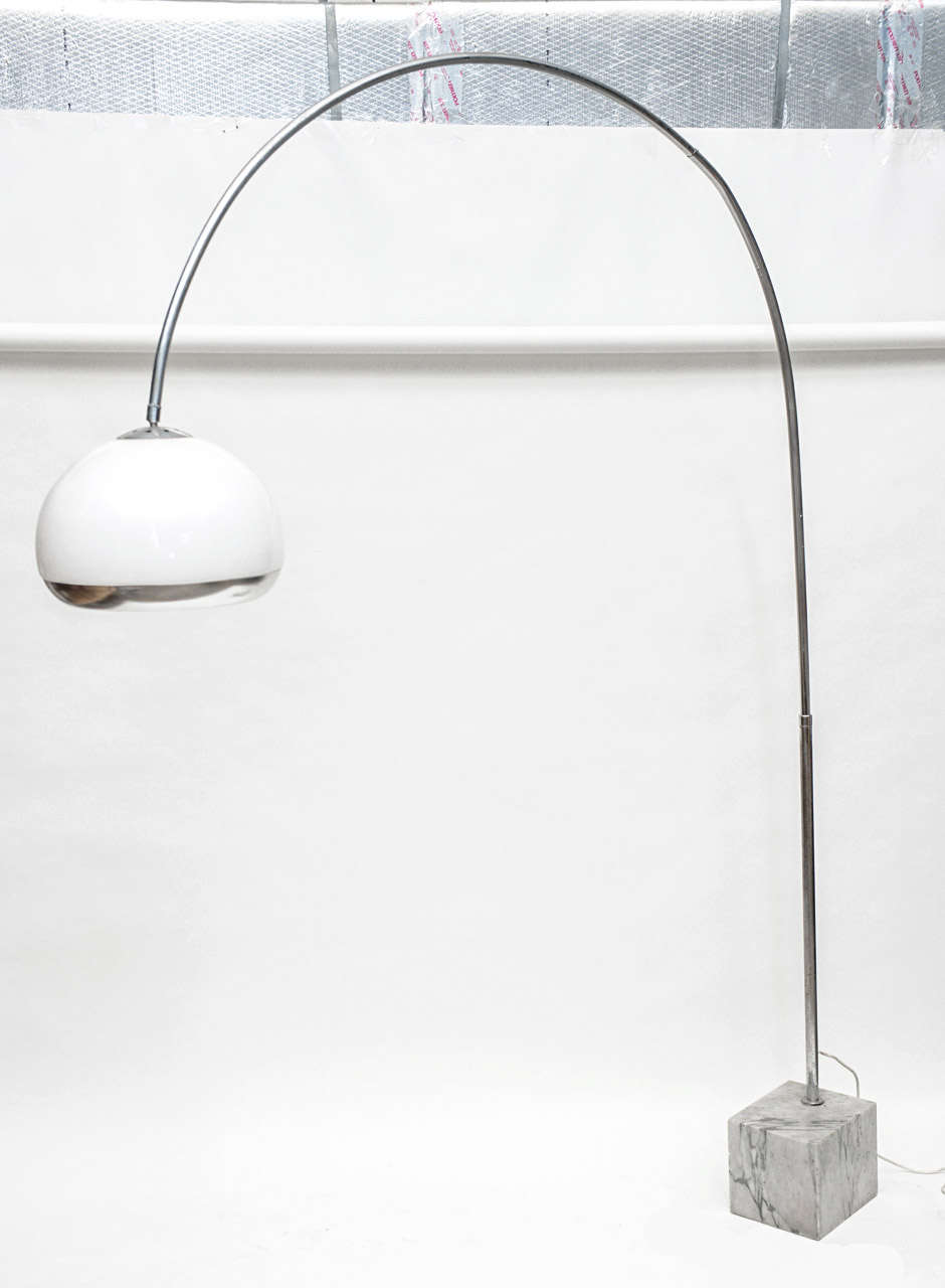Sweeping arched chrome floor lamp with white perspex and chrome shade seated on a heavy white Carrara marble base. The dome has three light functions (spot downlight, light that illuminates white globe and both on simultaneously. 
 
Base measures:
