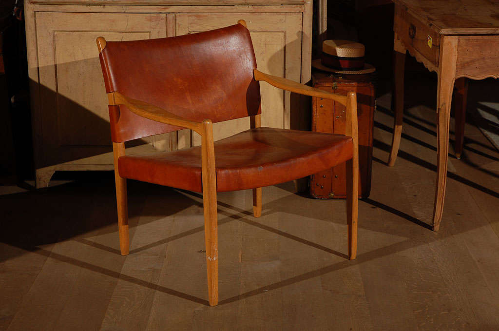 Perfectly aged leather chairs from Belgium. Sold as a pair.