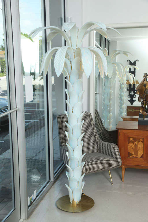 Murano glass palm trees from the Hotel Bristol in Bolanzo Italy. The trees are made of individual opalescent white glass leaves. Priced individually.