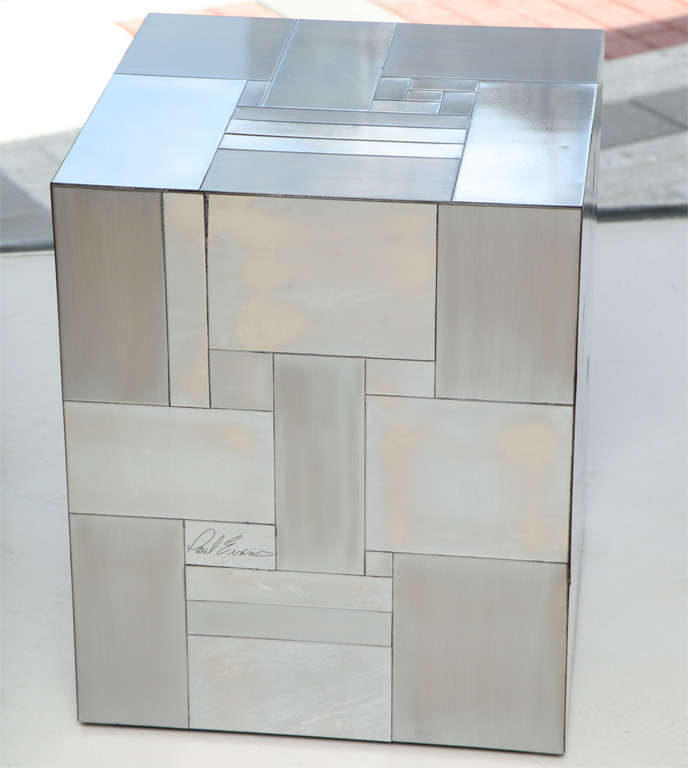 These Cityscape cubes are a patchwork of brushed and polished chrome. Signed 
