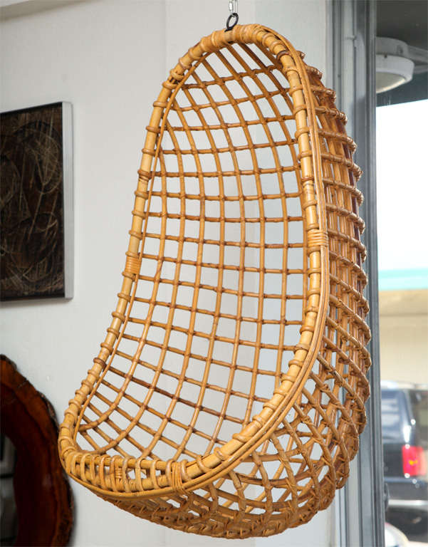 This chair is the real deal. 70's Bamboo egg chair hangs from its original chain and hand-forged hook, cradling you for a quiet Zen moment, indoors or out! Two available, priced individually.