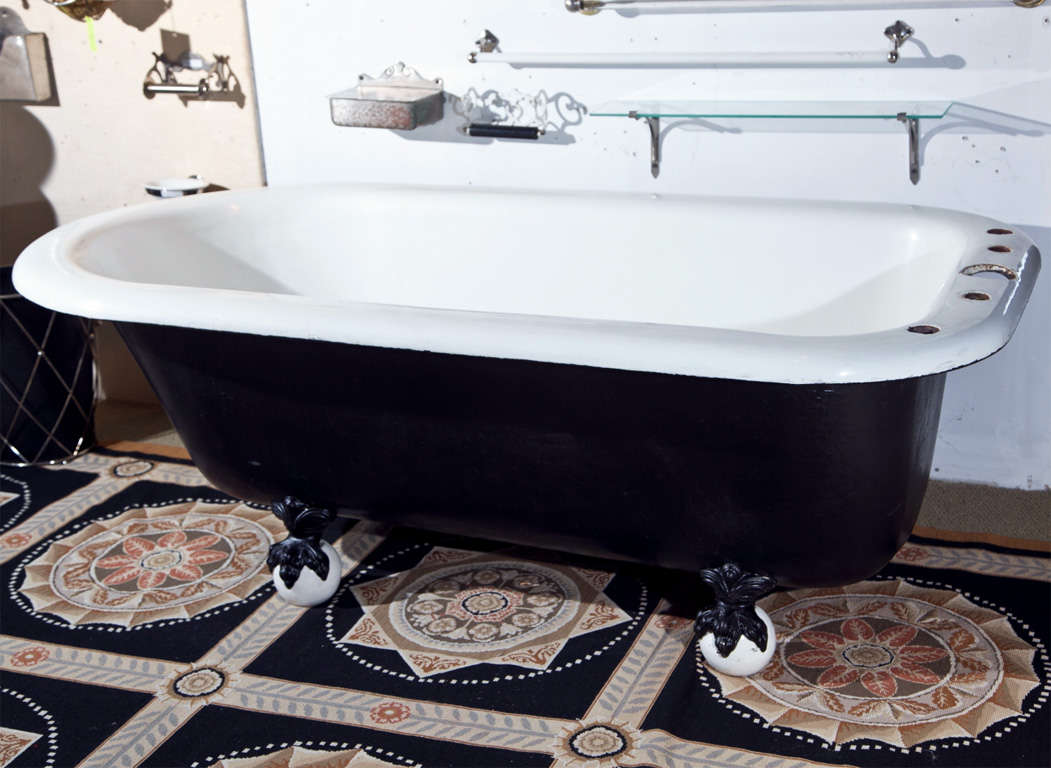This magnificent and rare J.L. Mott bathtub is exquisitely perserved in its original porcelain and earthenware ball feet.  Drilled for a 