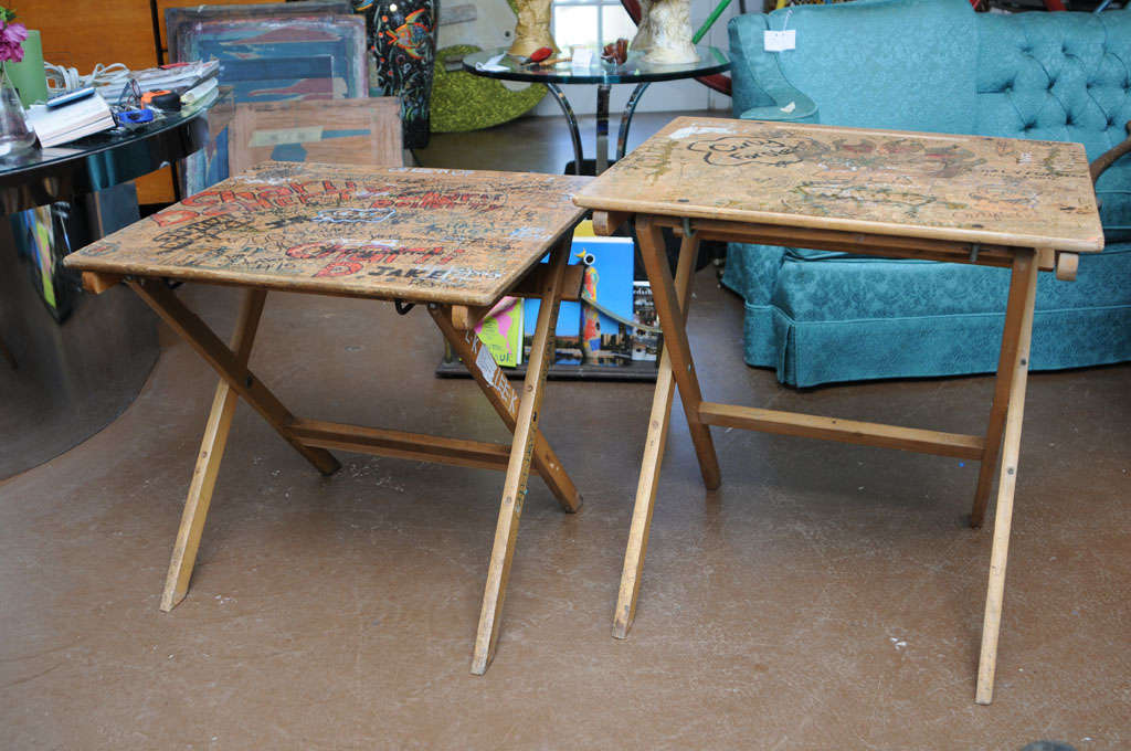 Whimsical, graffite topped fold up wooden desks from  London school house. Would make wonderful TV trays or end tables! Four available; priced individually.