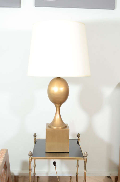 Elegant egg shaped lamp on pedestal. Patinated bronze.
