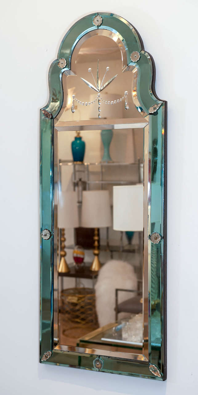 This delicate Queen Anne style mirror with etched crown and beveled glass 
is truly special. Its pale blue border and distressed details 
enhance this rare mirror.