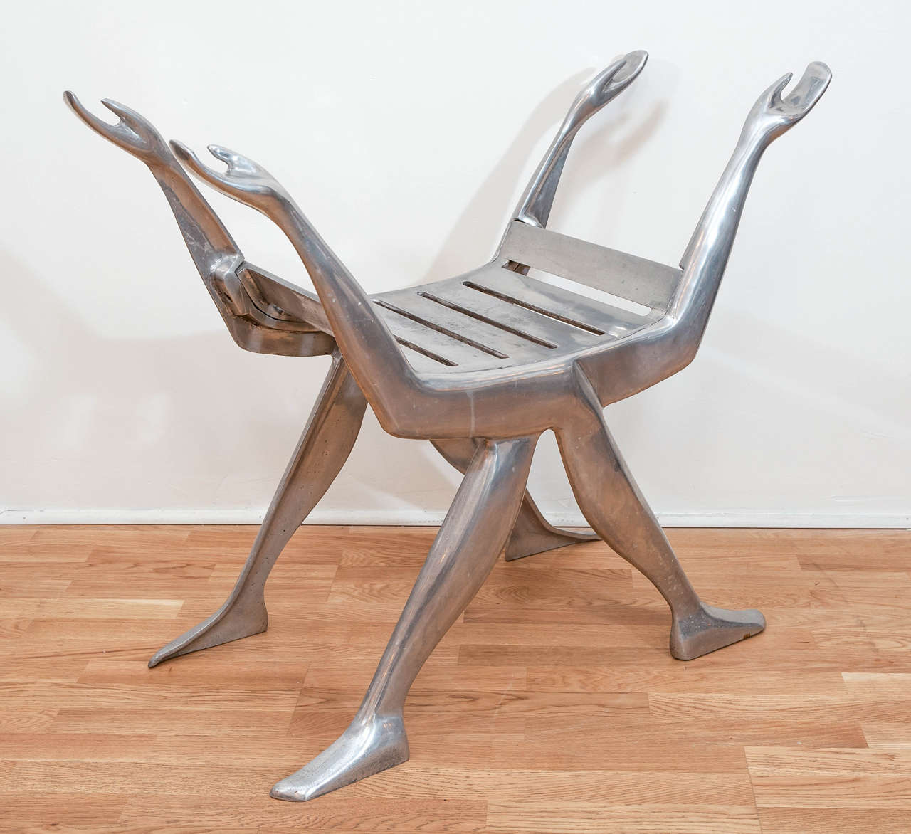 A daring and caprcious aluminum figural bench by Chicago sculptors Nancy Gensburg and Arleen Eichengreen. This functional sculpture/bench adds character and depth to any indoor or outdoor environment.