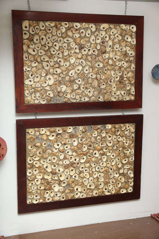 These very cool handmade panels came from a 1950's oyster bar in Louisiana. The oysters are set in cement and have a rich wood surround.(May be purchased individually).
