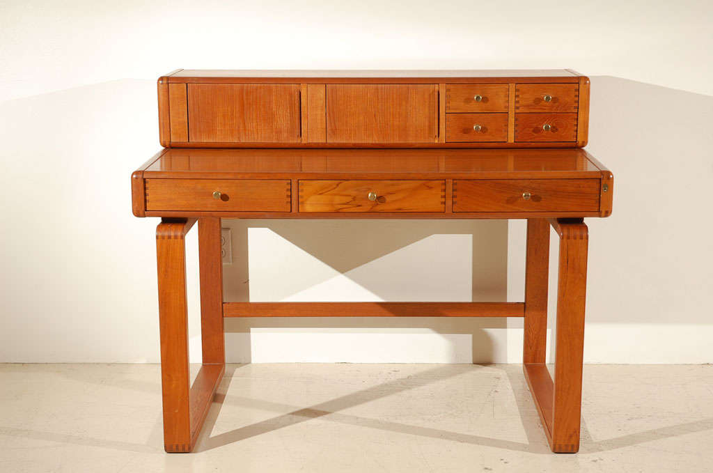 Custom two piece teak desk by D-Scan from a Palm Springs estate.  Drawer box on top has a vanity mirror, and locking drawers.  The drawer box on top is not attached to the desk and can be mounted on the wall if desired.