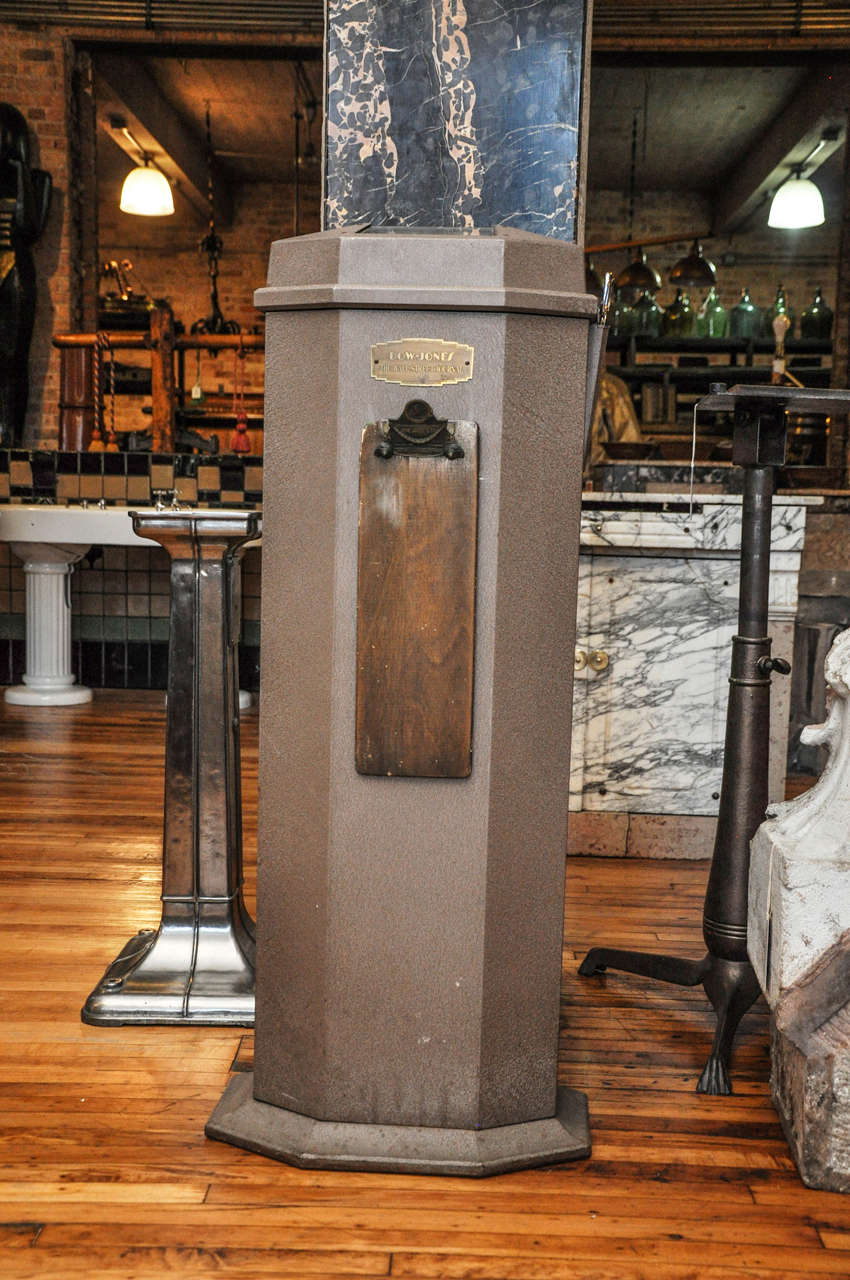 A Dow Jones stock ticker tape machine complete with ticker tape and clip board. This machine is circa 1940 and was primarily used before computers took over. This ticker tape machine would have been used to communicate telegrams, stock quotes, and