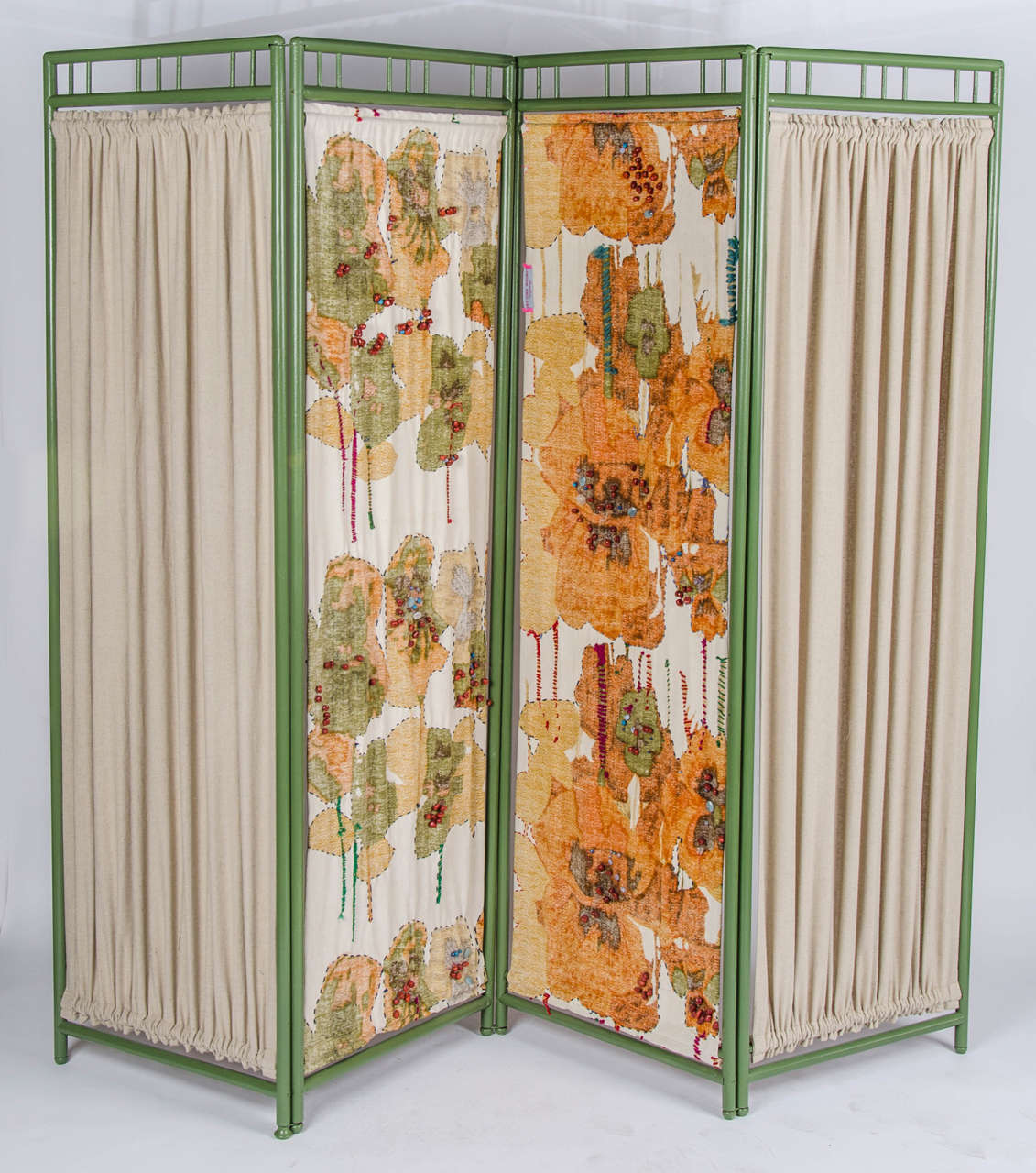 A beautiful early 20th-century wooden screen, re-upholstered with a floral detailed fabric from the 1970s.

Origin UK. Maker unknown.