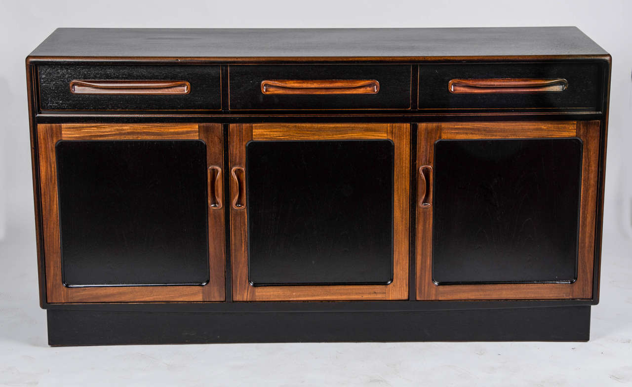 A 1970's Side Cabinet, in Rosewood, with contrasting black laquer.

Origin UK. Maker Unknown