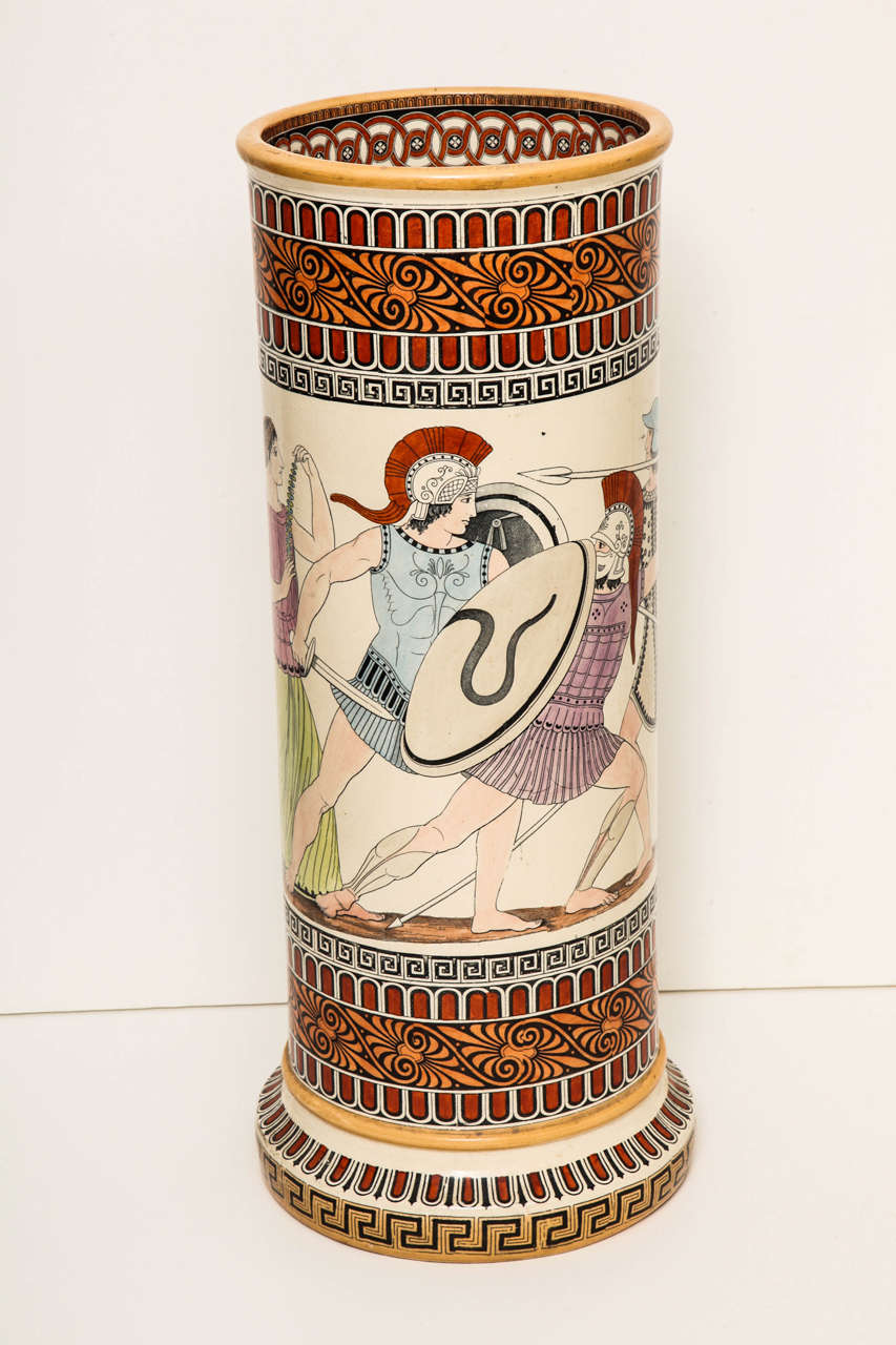 A 19th century English cylindrical umbrella stand polychrome decorated with neoclassical motifs, stamped Copeland.