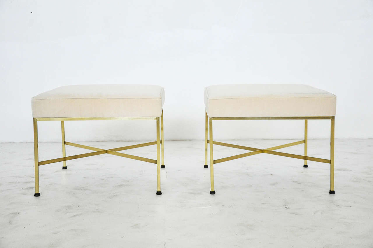 Pair of brass frame stools. Designed by Paul McCobb for Calvin Furniture. Newly upholstered in bone velvet.