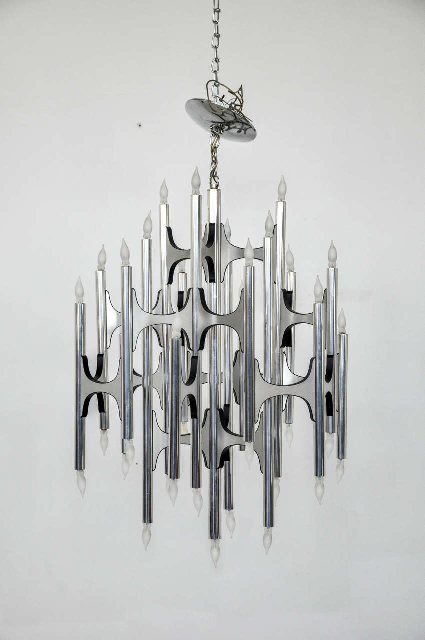 Large chandelier designed by Gaetano Sciolari. Sculptural form aluminum frame.