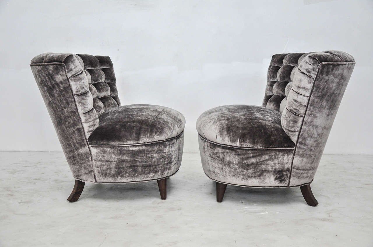 Pair of tufted slipper chairs by James Mont. Newly upholstered in silk velvet.